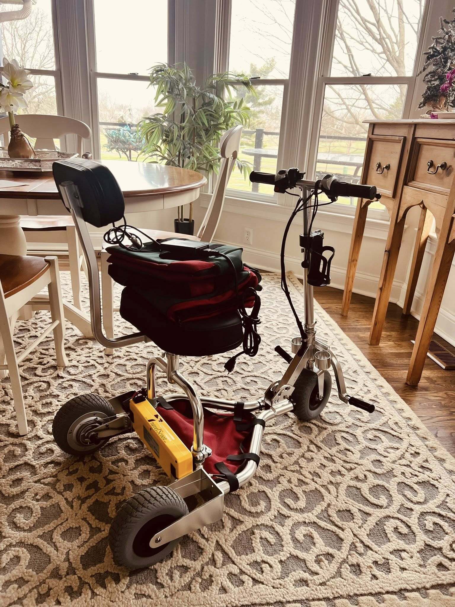 A mobility scooter in a living room in the morning light.