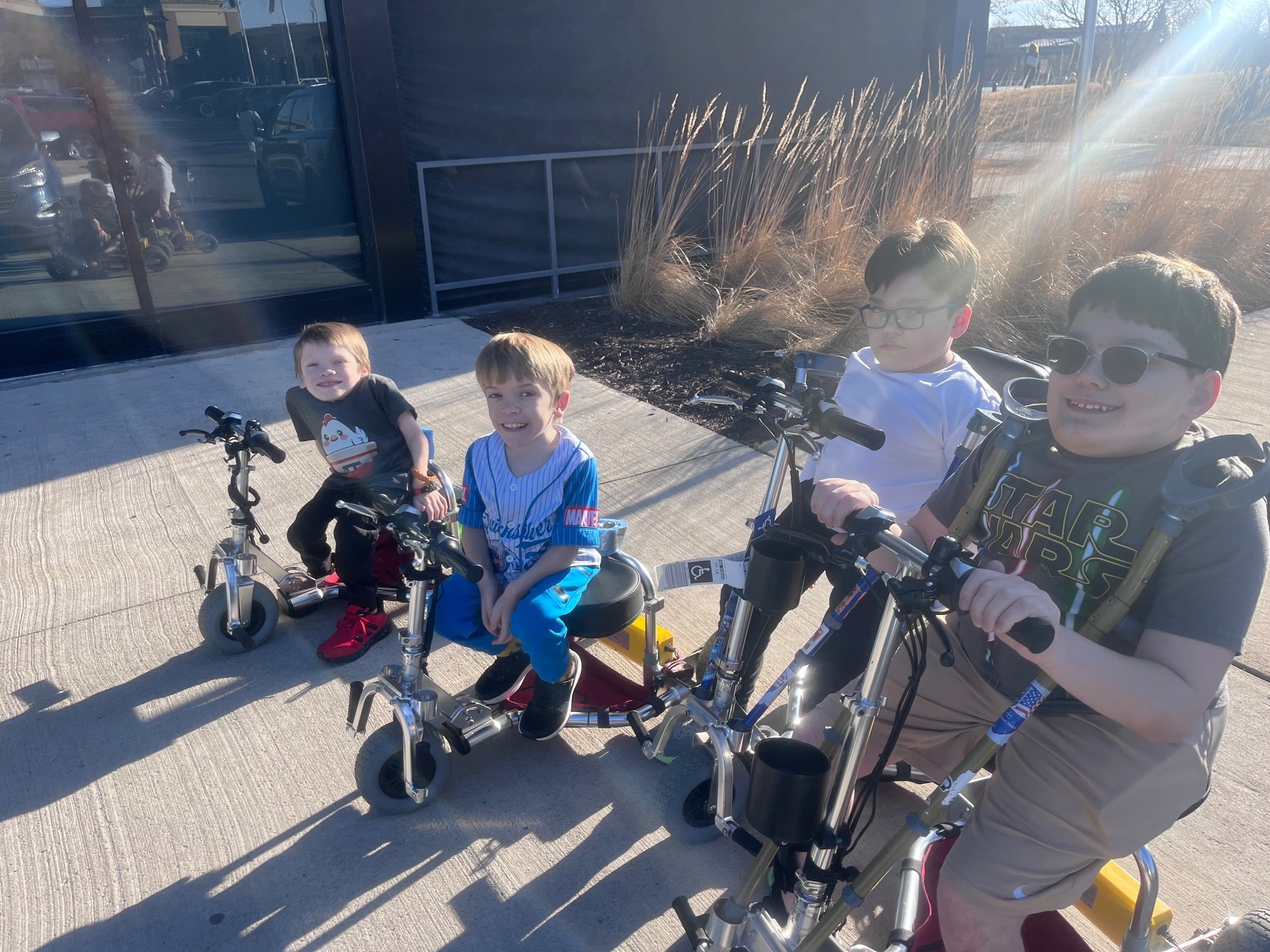 Multiple kids on travelscoot mobility scooters.